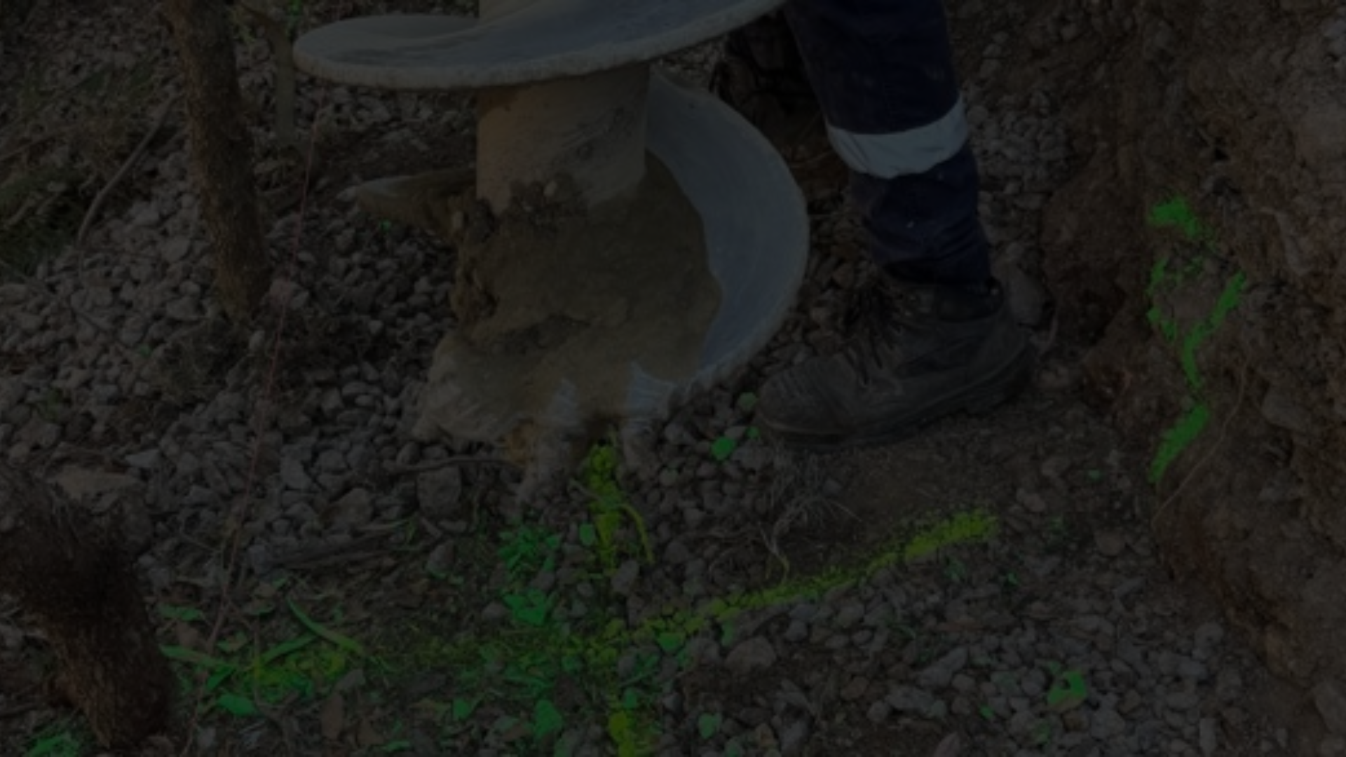 Retaining Wall Engineers Brisbane – auger drilling for retaining wall foundation preparation.