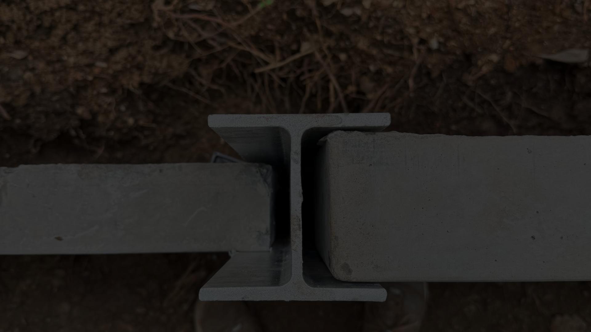 Retaining Wall Engineers Brisbane and Gold Coast â close-up of steel H-beam and concrete sleeper connection for retaining walls.