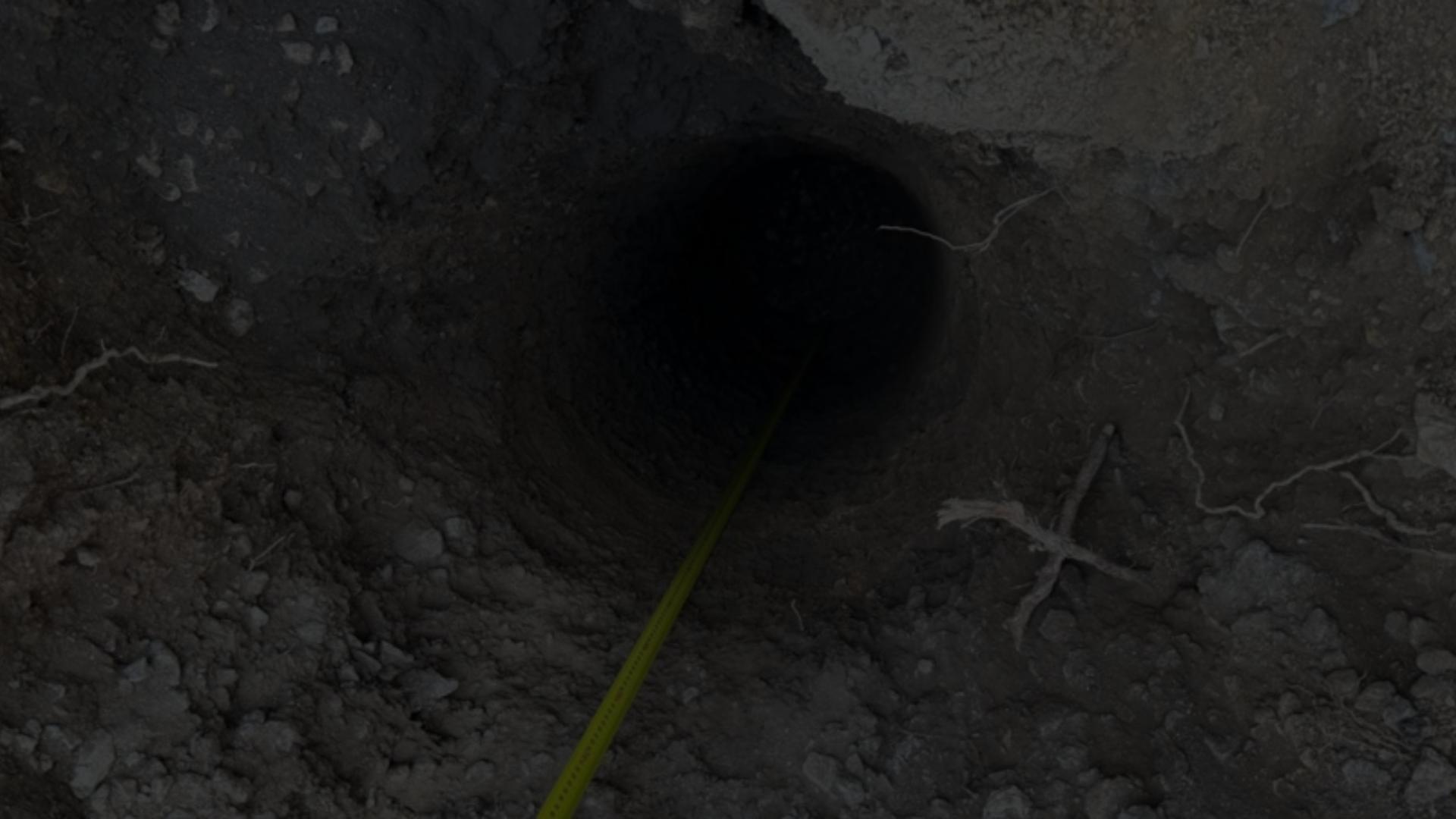 Retaining Wall Engineers Brisbane and Gold Coast â retaining wall footing bore hole with depth measurement.