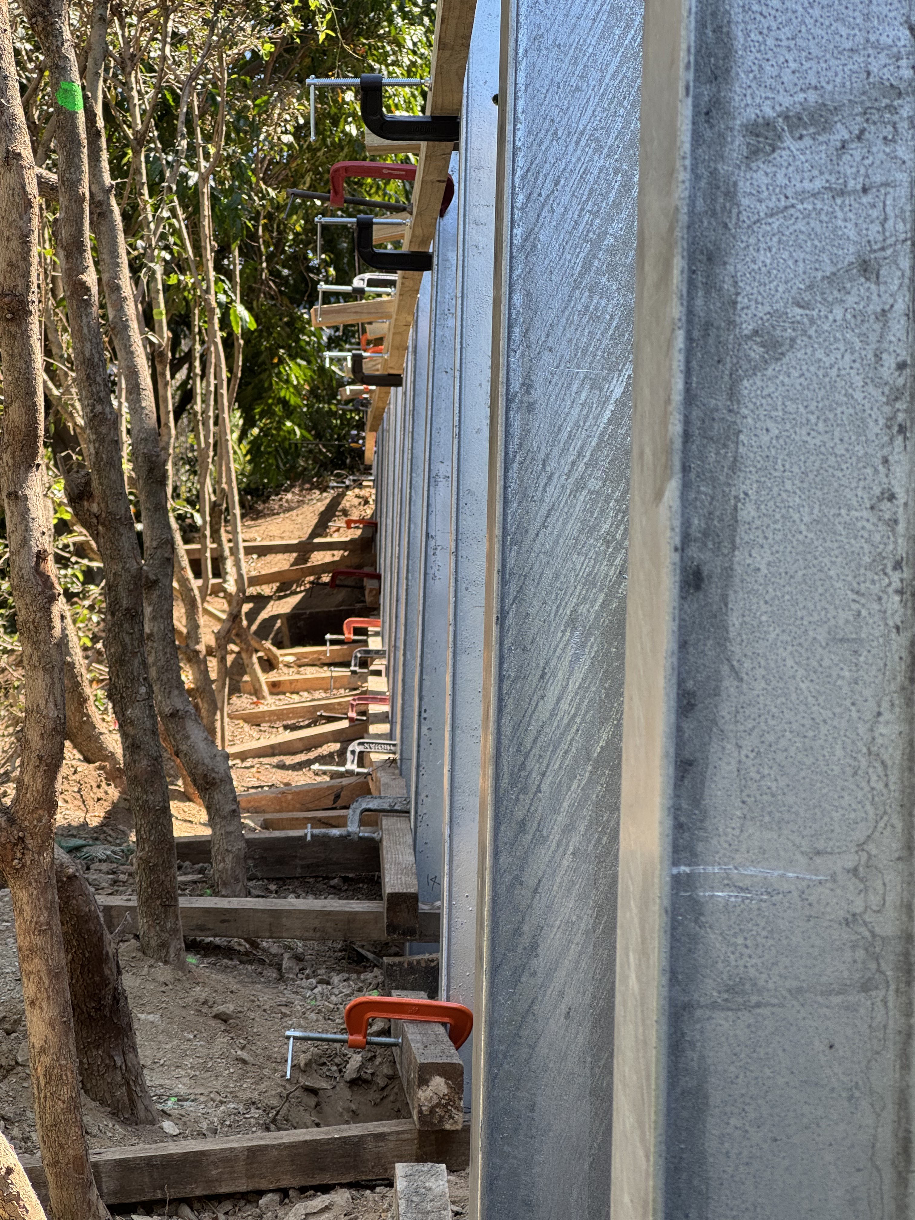Engineered retaining wall construction in tight access area in Brisbane