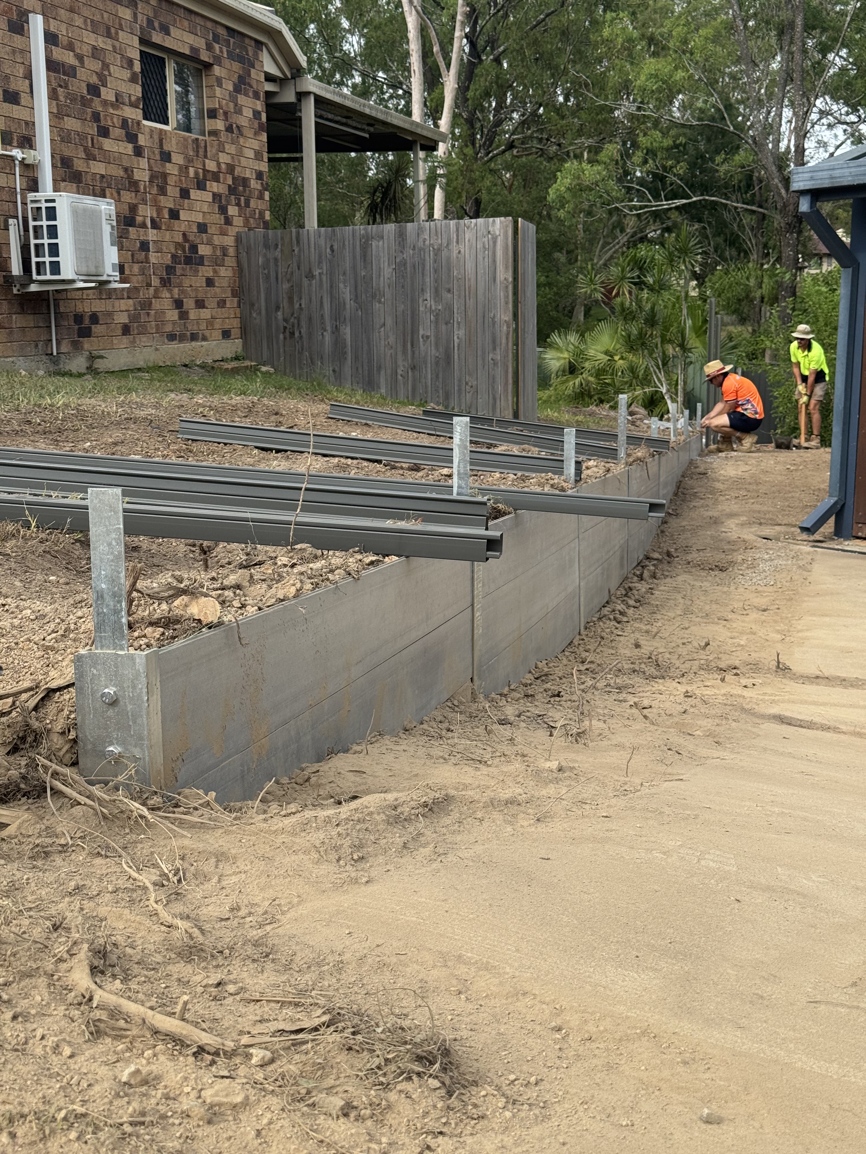 Concrete sleeper retaining wall construction by Brisbane retaining wall engineers